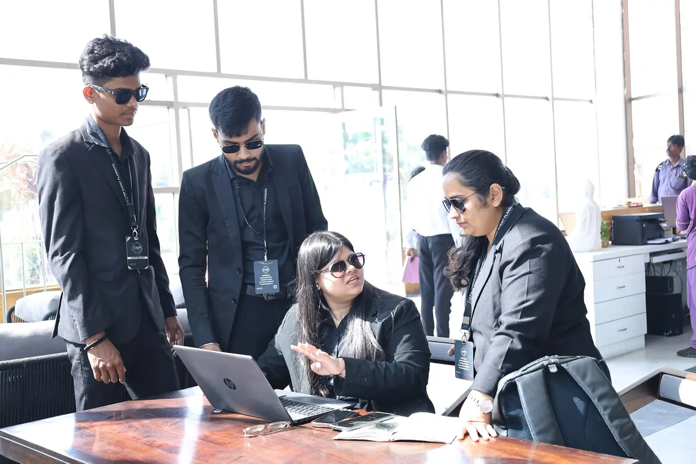 TNP team helping guests at a hospitality desk