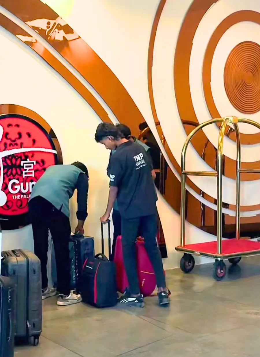 TNP team tagging guest luggage in a hotel lobby