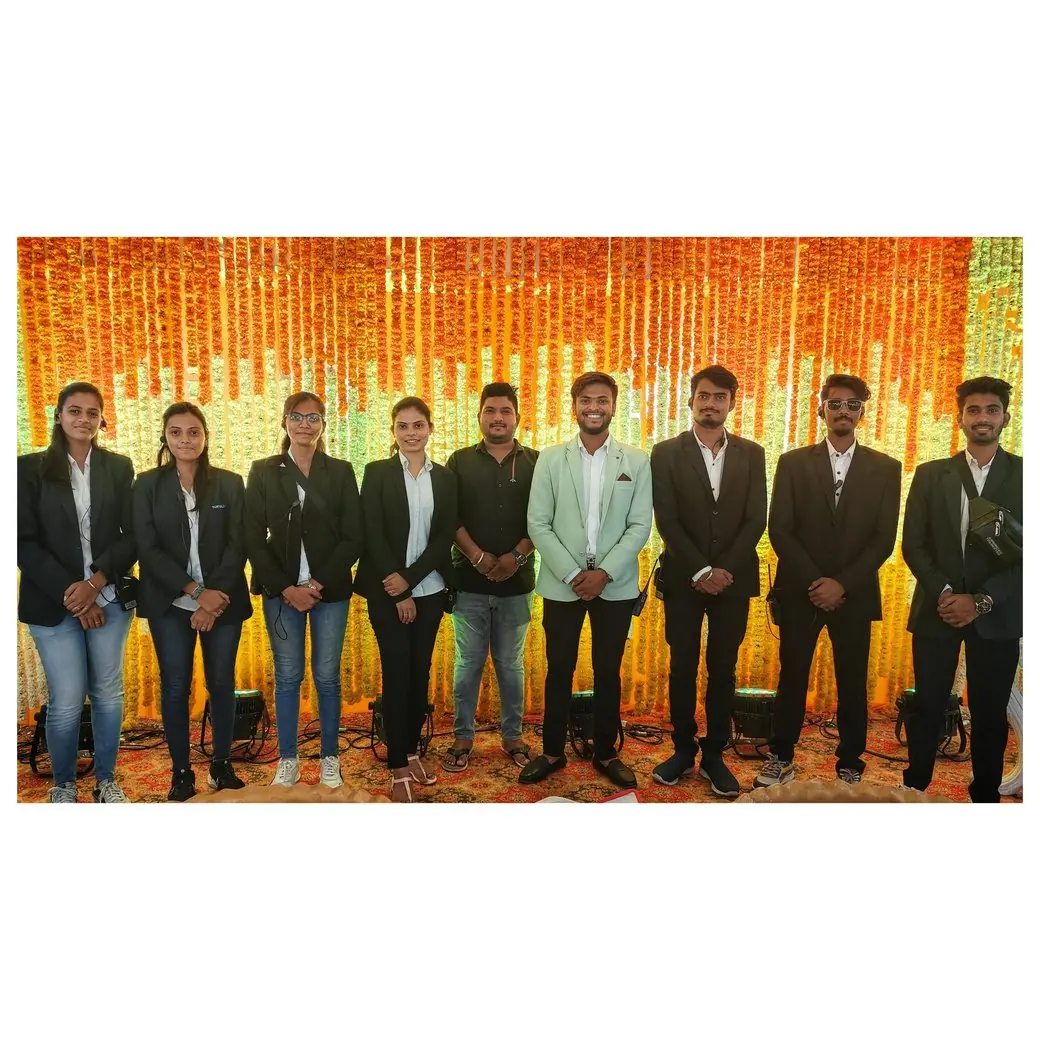 TNP team in front of a marigold backdrop